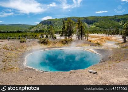 Hot thermal spring Black Sand Pool in Yellowstone National Park, Old Faithful area, Wyoming, USA