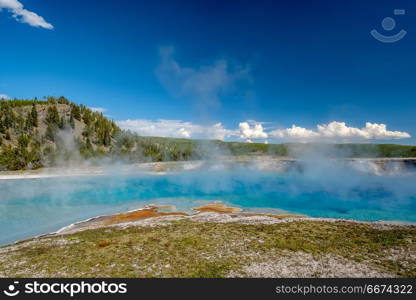 Hot thermal spring in Yellowstone . Hot thermal spring Excelsior Geyser Crater near Grand Prismatic Spring in Yellowstone National Park, Wyoming, USA