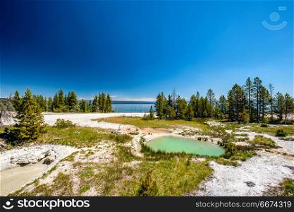 Hot thermal spring in Yellowstone . Hot thermal spring in Yellowstone National Park, West Thumb Geyser Basin area, Wyoming, USA
