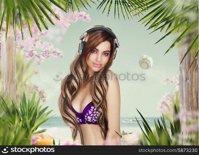 Hot Woman with Headphones on the Beach