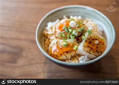 Hotate on rice with uni sauce, Grilled fried scallop rice, gourmet japanese cuisine.