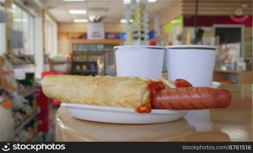 Hotdogs and drinks for lunch in petrol station convenience store