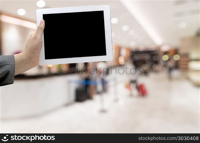hotel lobby blurred background. Abstract Blurred background of modern hotel lobby with digital Tablet