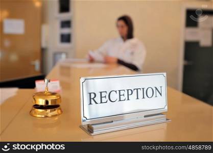 hotel reception desk with bell