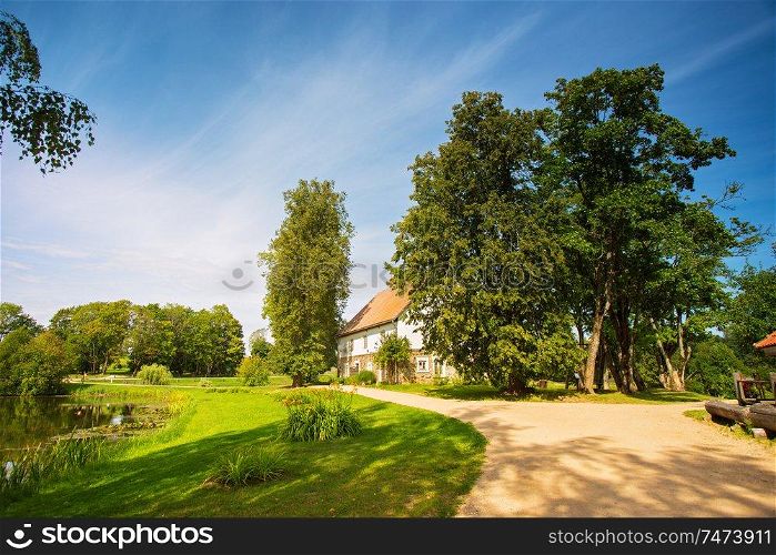 House at the lake bank in autumn. Countryside landscape near a famous Latvian resort Sigulda, Latvia, Vidzeme Region, Turaida Museum Reserve, Europe