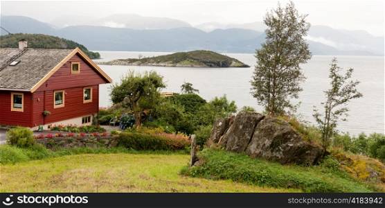 House at waterfront, Hardanger, Hardangerfjord, Hardangervidda, Hardanger, Norway