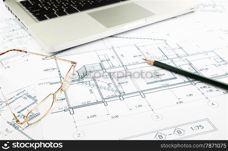 house blueprints and floor plan with keyboard, architecture business concepts and ideas