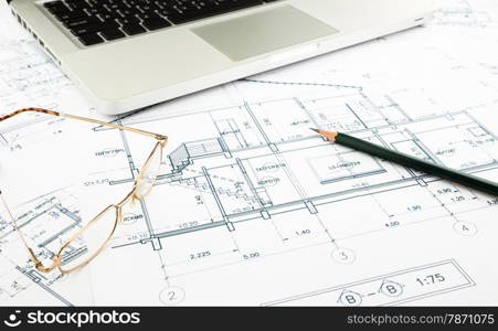 house blueprints and floor plan with keyboard, architecture business concepts and ideas