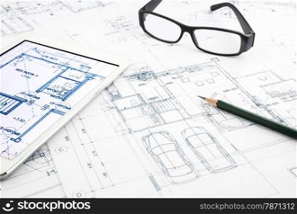 house blueprints and floor plan with tablet, architecture business concepts and ideas