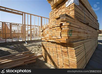 House construction and stack of planks