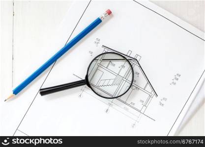 House drawings with pencil and magnifier