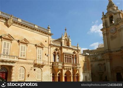 House facade at St. Pauls&rsquo;s Square and St. Paul&rsquo;s Cathedral in Mdina, Malta .. House facade at St. Pauls&rsquo;s Square and St. Paul&rsquo;s Cathedral in Mdina, Malta