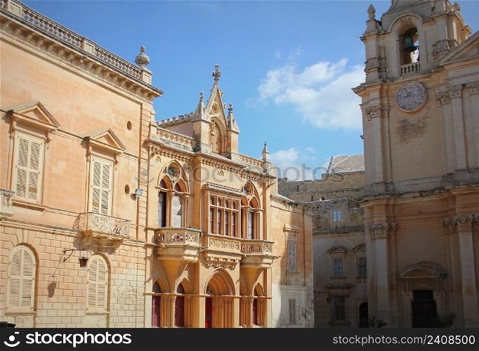 House facade at St. Pauls&rsquo;s Square and St. Paul&rsquo;s Cathedral in Mdina, Malta .. House facade at St. Pauls&rsquo;s Square and St. Paul&rsquo;s Cathedral in Mdina, Malta