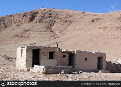 House in desert near mount in Syria