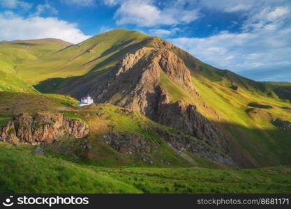 House in mountain green valley and morning sunshine. Nature landsape.