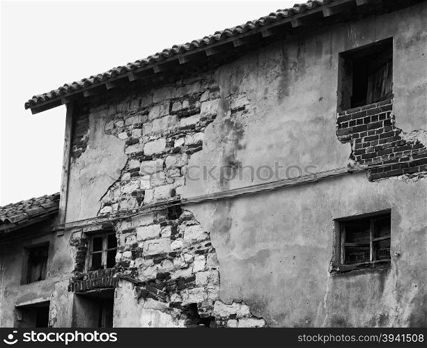 House in ruins, detail of high part, black and white horizontal image