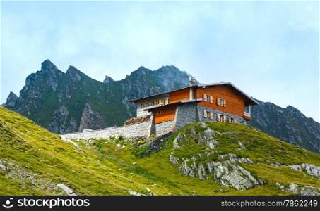 House in summer mountain. View from Transfagarasan road (Romania)