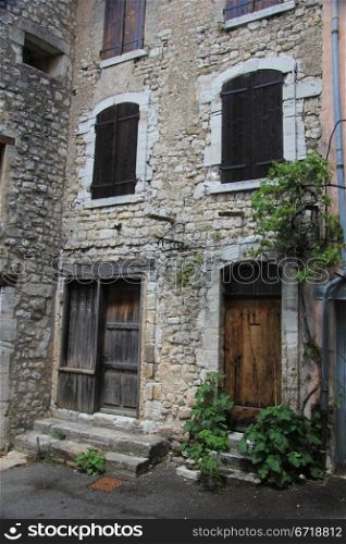 House in the Provence, France. Wooden painted shutters