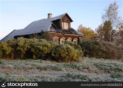 House in the Russian village on the first frosty morning in the fall.