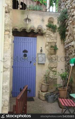 House in typical provencal style in France, windows with wooden shutters