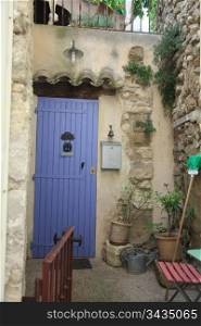 House in typical provencal style in France, windows with wooden shutters