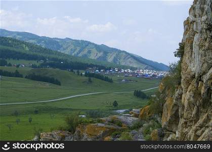 house landscape among Mountains Altai
