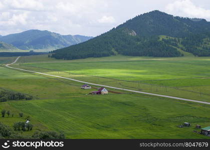 house landscape among Mountains Altai the top view