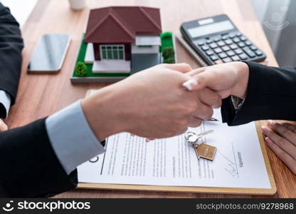 House loan agreement was successfully finalized with handshake. Buyers and real estate agents are celebrate home ownership agreement of property with sense of accomplishment and satisfaction. Jubilant. House loan agreement was successfully finalized with handshake. Jubilant