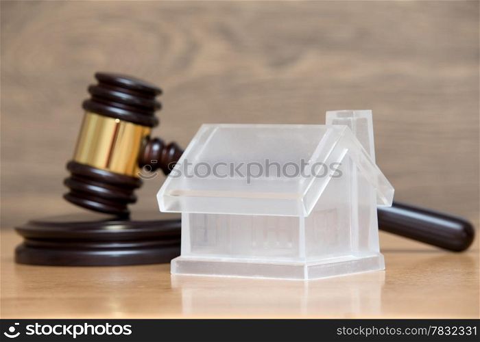 house model and a brown gavel
