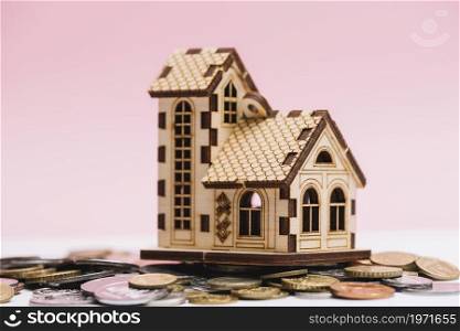 house model coins front pink background. High resolution photo. house model coins front pink background. High quality photo