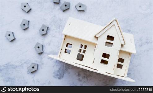 house model with many small bird houses concrete background