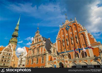 House of the Blackheads and Saint Peters church in Riga in a beautiful summer day, Latvia