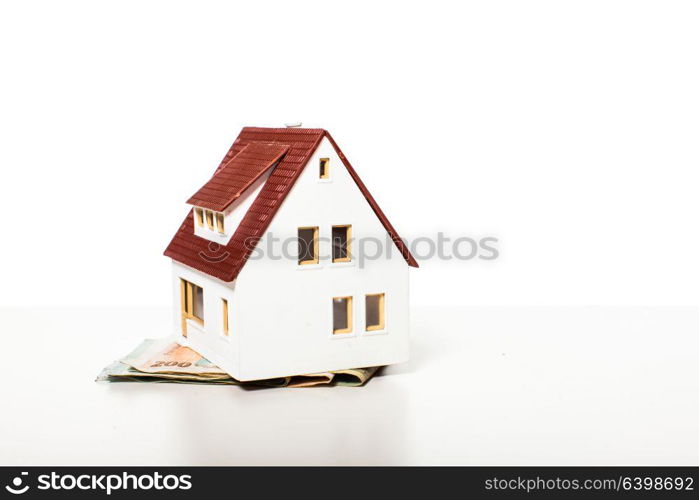 House on a banknotes. Concept for property ladder, mortgage and real estate investment. The concept mortgage