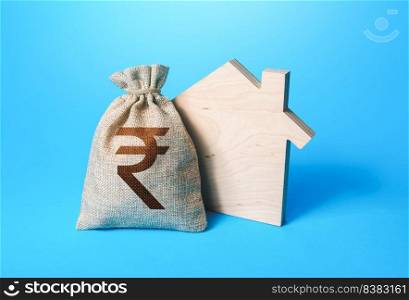 House silhouette and a indian rupee money bag. Mortgage loan. Realtor services. House project development. Rental business. Property appraisal. Home purchase, investment in real estate construction.