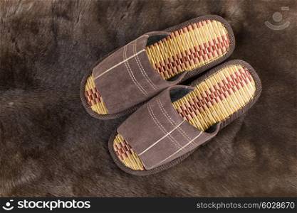 House slippers on a fur rug