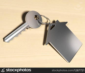 house symbol keyring and a key over a wooden background, real-este symbol . real estate concept