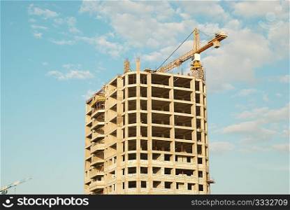 House under construction with blue sky background