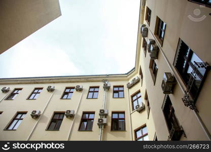 House view from the bottom up at the sky. House with air conditioning in Old Riga, Latvia.