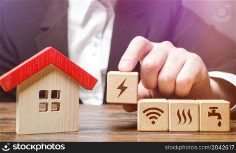 House with home service utilities blocks. Installation of communications and conclusion of contracts with supply companies. Electricity, water and gas. Internet services. Connecting to city network