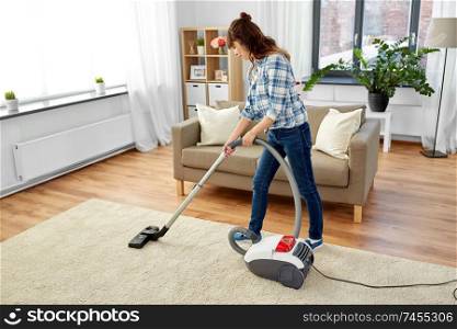 household, housework and cleaning concept - asian woman or housewife with vacuum cleaner at home. asian woman with vacuum cleaner at home