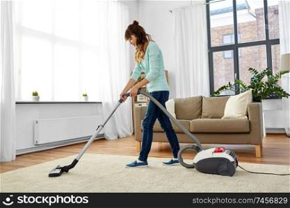 household, housework and cleaning concept - asian woman or housewife with vacuum cleaner at home. asian woman with vacuum cleaner at home