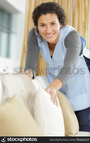 housekeeper cleaning a hotel room