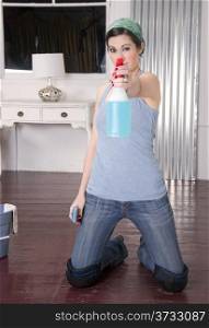 Housekeeper Points Cleaning Spray At Camera Cleans Floor Knees