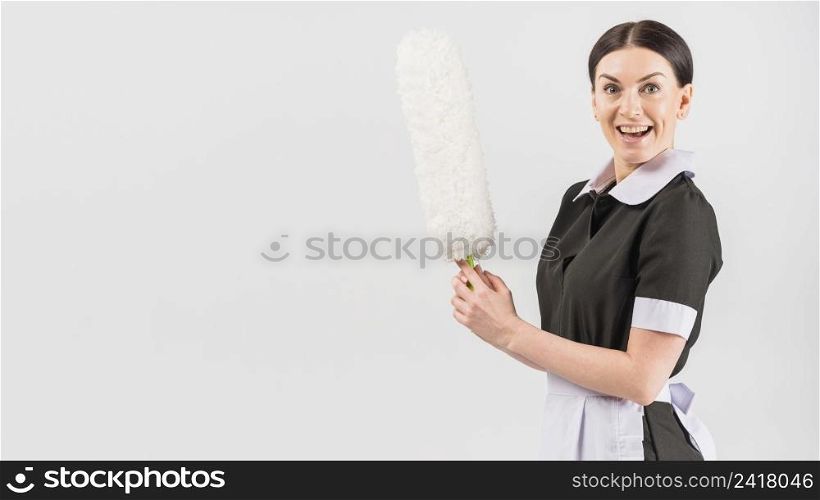 housekeeper with happy surprised face duster