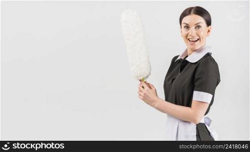 housekeeper with happy surprised face duster