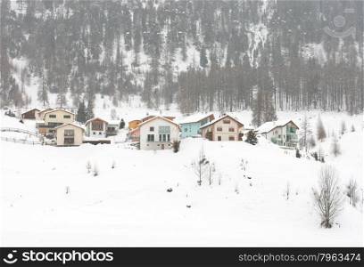 Houses, after a snowstorm, in Northern Italy