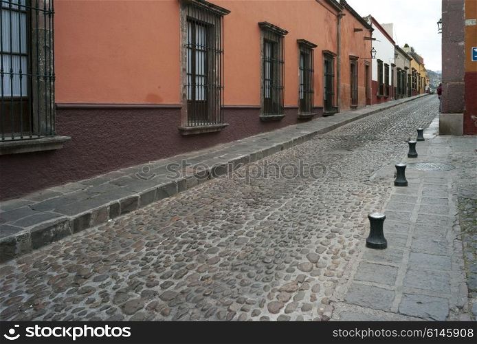 Houses along a cobblestone street, San Miguel de Allende, Guanajuato, Mexico