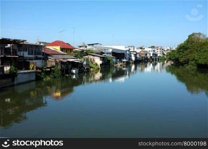 Houses along canal in Thailand