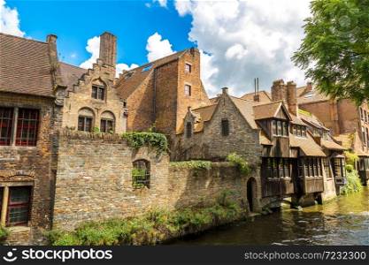 Houses along the canal in Bruges in a beautiful summer day, Belgium