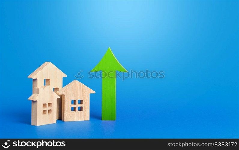 Houses and green arrow up. Rising prices and rents. Make money by investing in real estate. Improve housing. High demand. Growth of mortgage rates. Increasing cost of housing concept.
